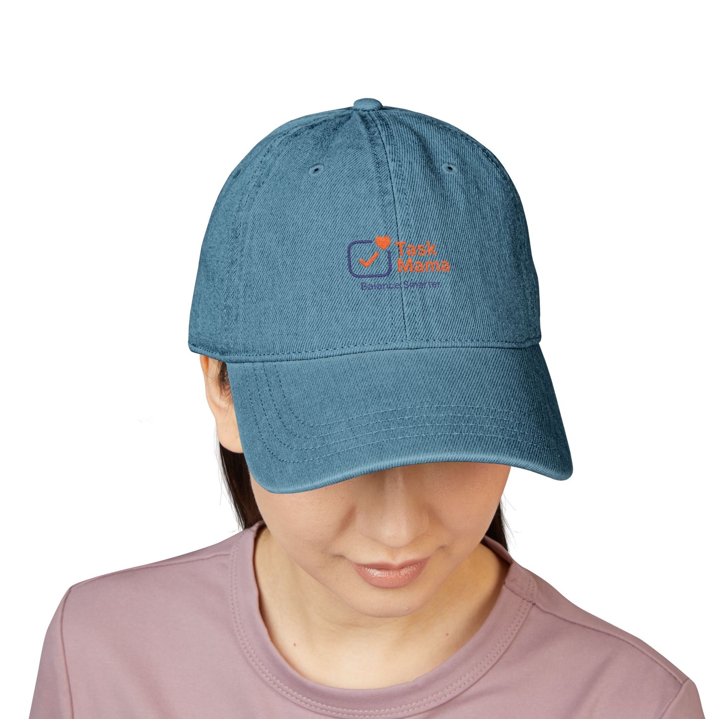 Blue cap with a logo worn by a person on a white background
