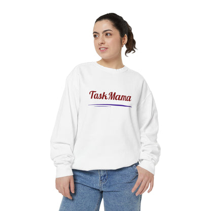 Woman wearing a white sweatshirt with 'Task Mama' text on a white background
