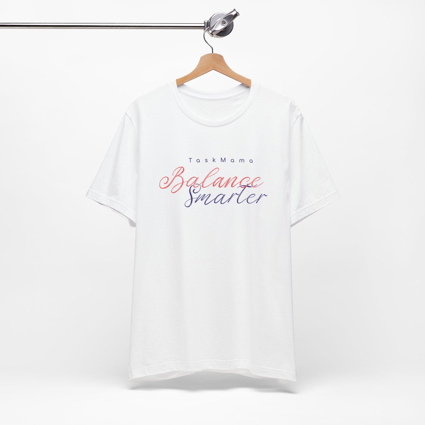 White t-shirt with 'Balance Smarter' text on a hanger against a white background