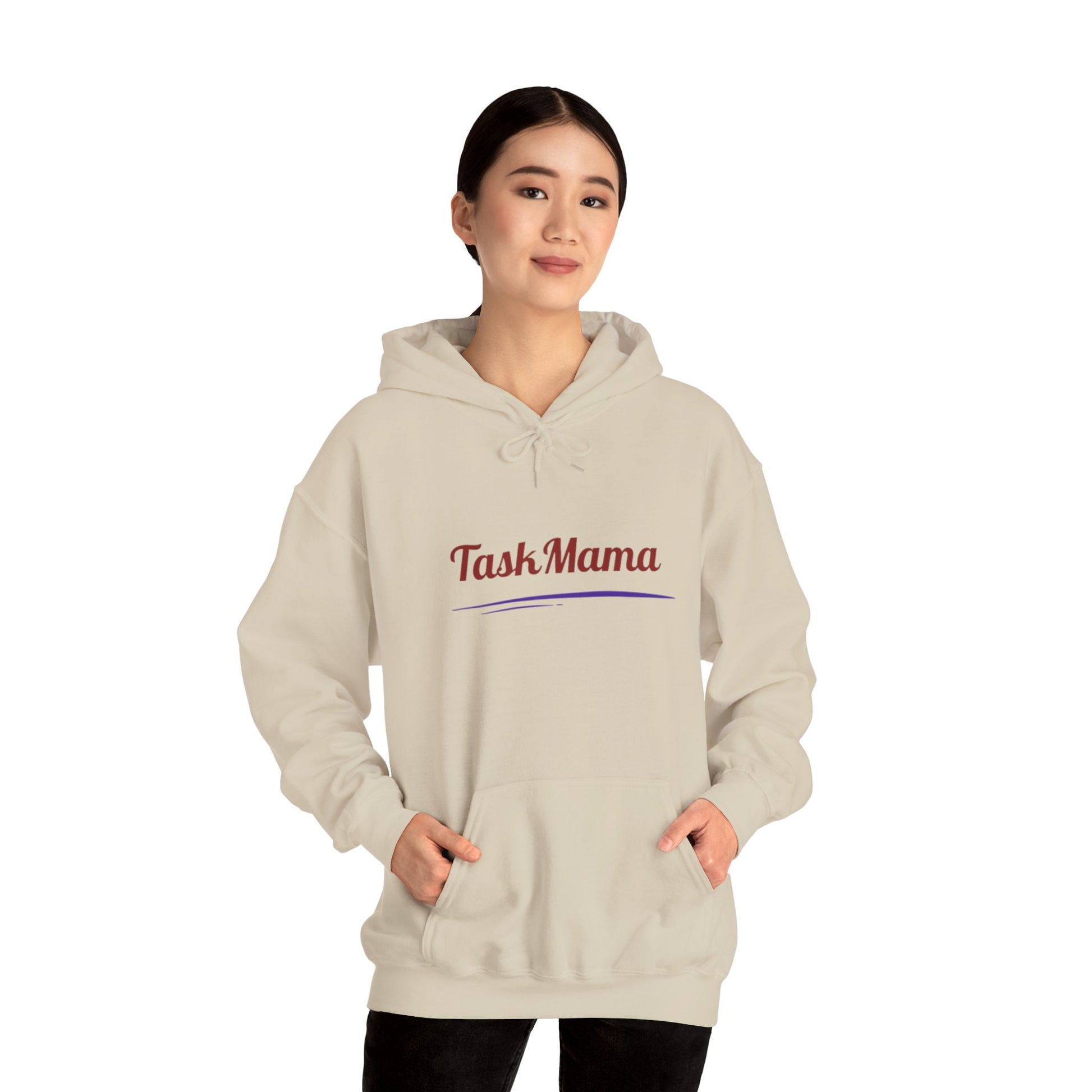 Person wearing a beige hoodie with 'Task Mama' text on a white background