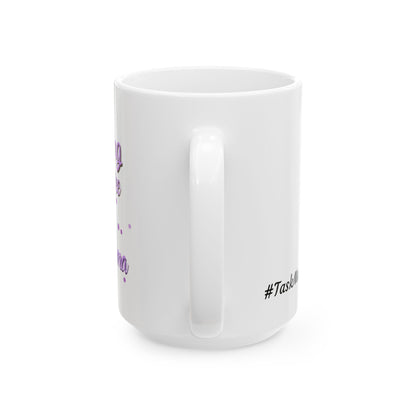 White mug with 'Running on coffee and TaskMama' text, surrounded by Halloween-themed treats and pumpkins.