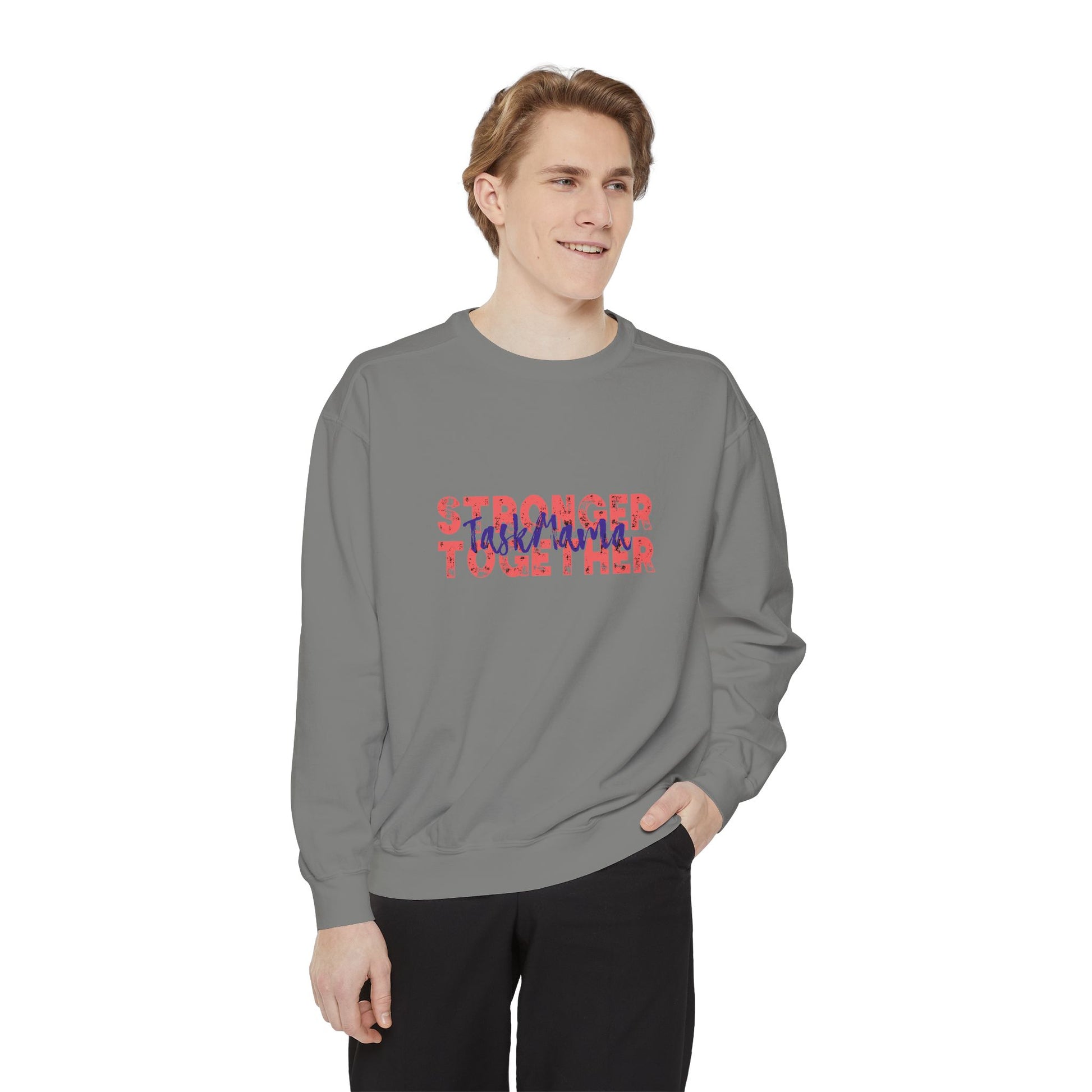 Person wearing a gray sweatshirt with colorful text on a white background