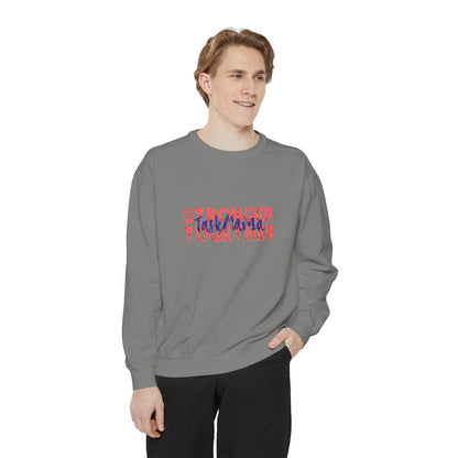 Person wearing a gray sweatshirt with colorful text on a white background