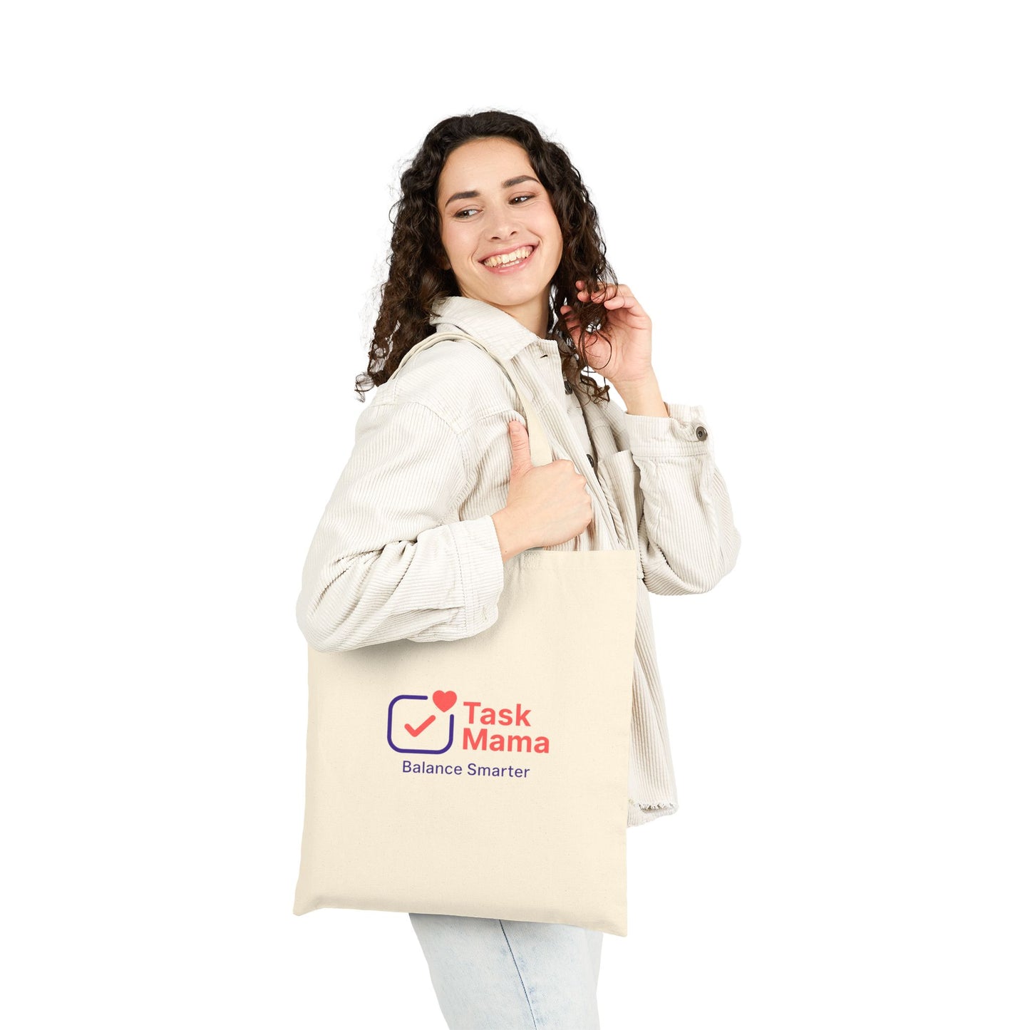 Woman holding a tote bag with 'Task Mama' logo on a white background
