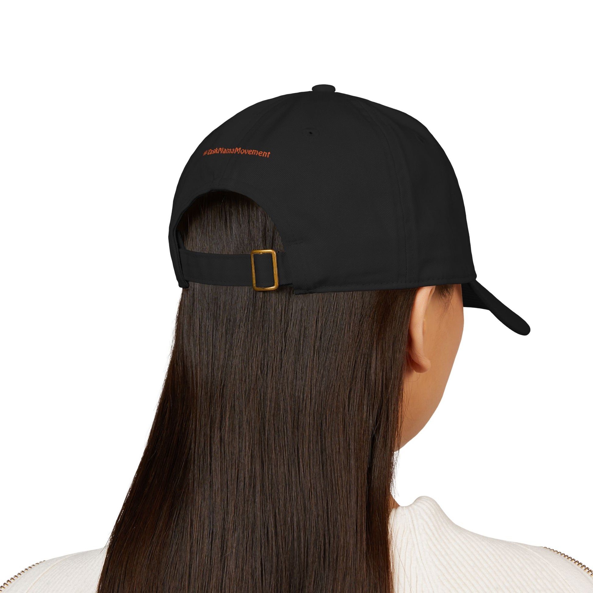 Person wearing a black cap with a brand logo on the back, on a white background