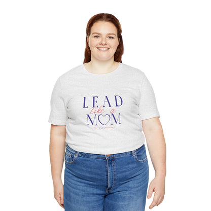 Person wearing a white t-shirt with 'Lead Like a Mom' text on a white background