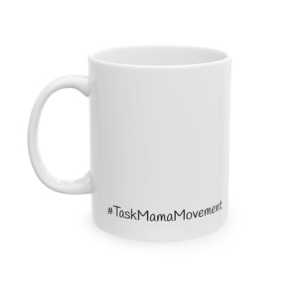 White mug with '#TaskMamaMovement' text on a white background