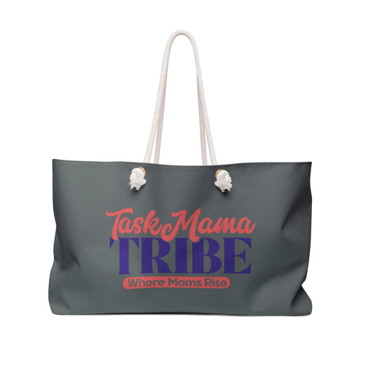 Gray tote bag with 'TaskMama TRIBE Where Moms Rise' text on a white background