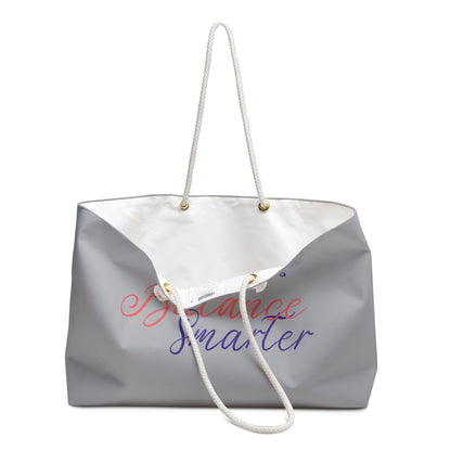 Gray tote bag with 'Be Nice, Smile' text on a white background