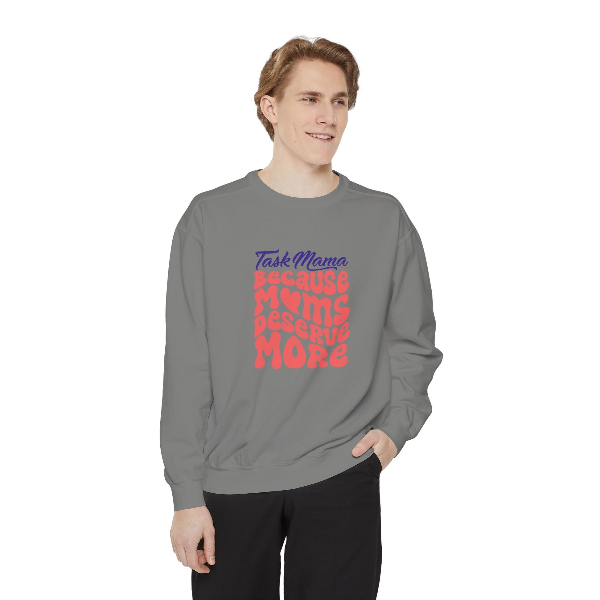 Person wearing a gray sweatshirt with colorful text on a white background