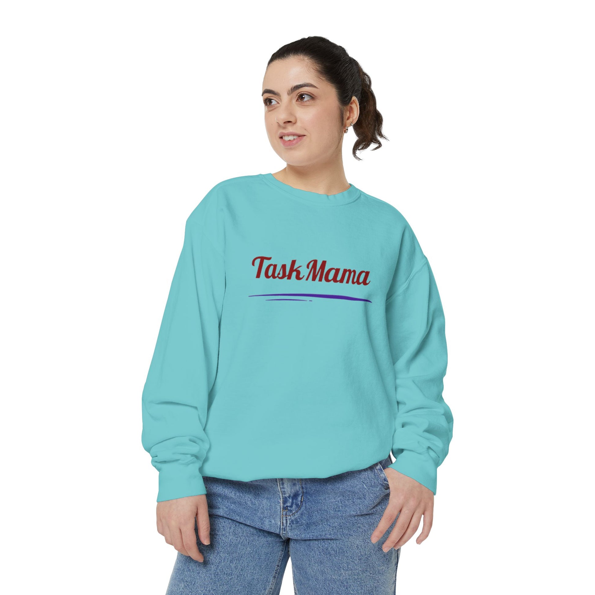 Woman wearing a light blue sweatshirt with 'Task Mama' text on a white background