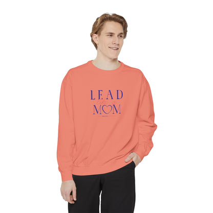Person wearing a coral sweatshirt with 'Lead Mom' text on a white background