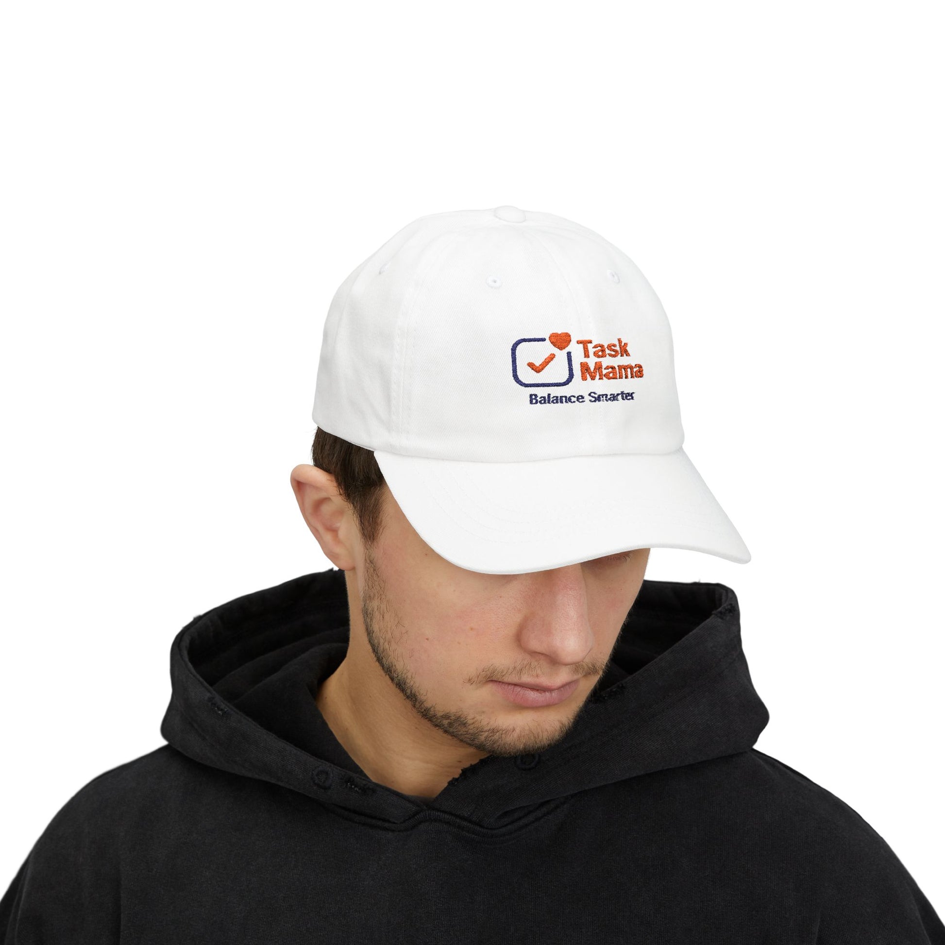 Person wearing a white cap with 'Task Mama' logo on a white background