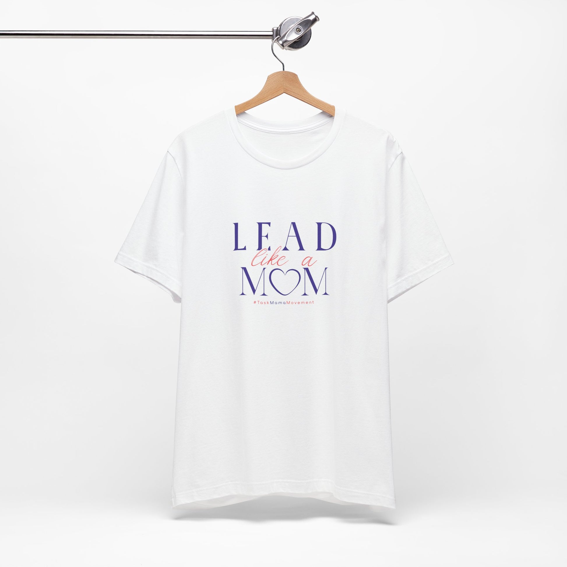 White t-shirt with 'Lead Like a Mom' text on a hanger against a white background