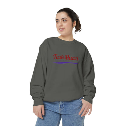 Woman wearing a gray sweatshirt with 'Tash Mama' text on a white background